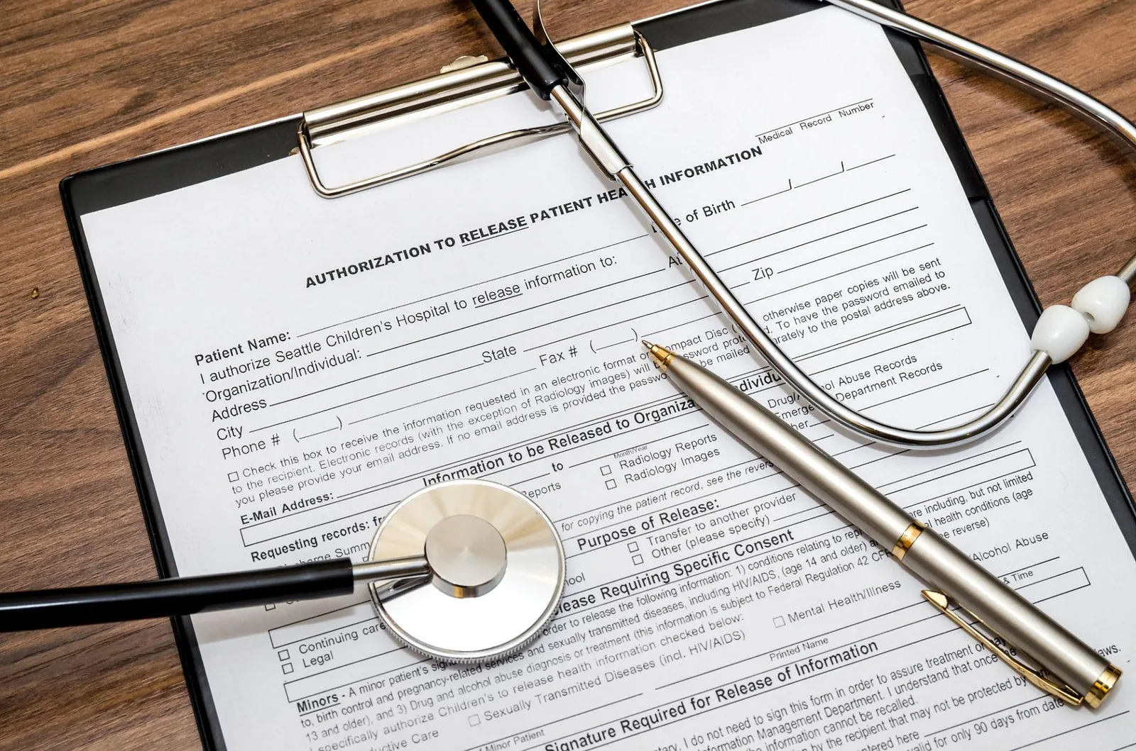 Medical privacy documents and patient forms on a desk